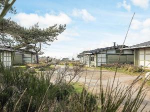 a row of houses on a dirt road at 6 person holiday home in Gilleleje in Gilleleje