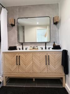 a bathroom with a sink and a mirror at Casa Nova Romantic Desert Escape in Yucca Valley