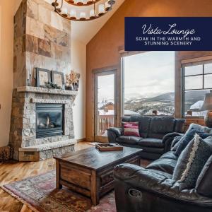 a living room with a couch and a fireplace at Hygge Hideaway in Winter Park