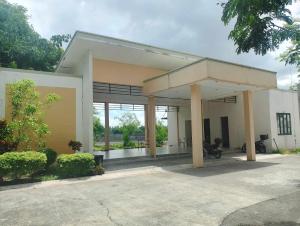 a building with a motorcycle parked in front of it at Valor Ain Villa in Tarlac
