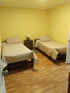 Giường trong phòng chung tại Hostal Nancy