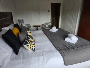 Postel nebo postele na pokoji v ubytování Santa Rosa Hotel boutique