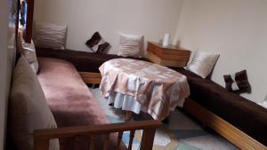 En eller flere senge i et værelse på Chez Faouzia