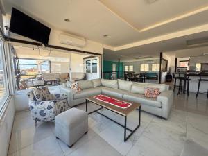a living room with a couch and a table at Sueño de Tafi in Tafí del Valle