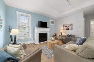 a living room with a couch and a fireplace at The Elm - 36 Hollow in Cherry Valley +65 photos