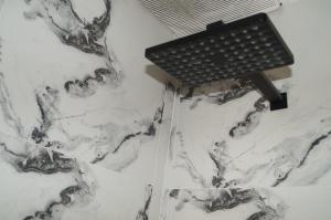 a table sitting on top of a white marble floor at Casa Marian in Lima
