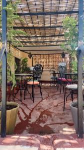 a group of tables and chairs in a patio at Dawya terrace in Fez +20 photos