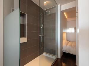 a shower with a glass door in a bathroom at Studio in Ostend near Beach and Promenade in Ostend +32 photos