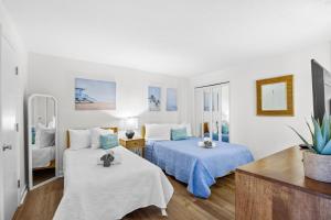 Voodi või voodid majutusasutuse Direct Ocean Front 3BR 3BA Beach Front toas