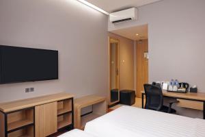 Ein Bett oder Betten in einem Zimmer der Unterkunft Best Western Sagita Hotel Jayapura