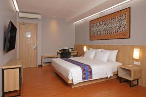 Postel nebo postele na pokoji v ubytování Best Western Sagita Hotel Jayapura