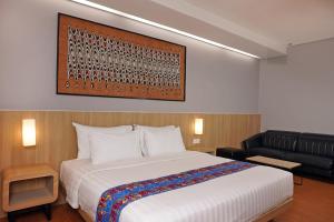 Ein Bett oder Betten in einem Zimmer der Unterkunft Best Western Sagita Hotel Jayapura