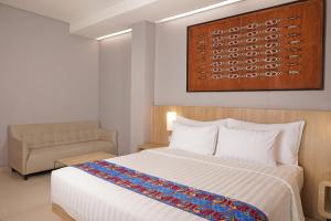 Ein Bett oder Betten in einem Zimmer der Unterkunft Best Western Sagita Hotel Jayapura