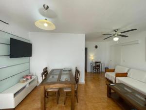 a living room with a table and a couch at Piso Luna in Mojácar
