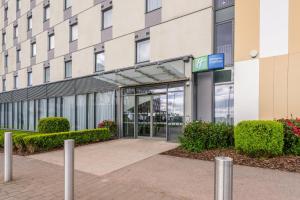 an entrance to a building with a glass door at Holiday Inn Express Aberdeen Airport by IHG in Dyce