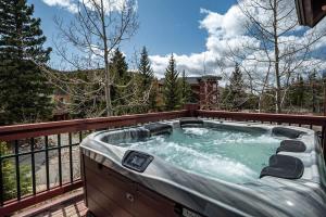a hot tub on the deck of a house at Trademark Views in Winter Park