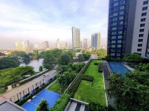a view of a city with a river and buildings at The Park at West Luxury Condo in Bangkok +23 photos