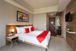 Postelja oz. postelje v sobi nastanitve Ramada by Wyndham Serpong