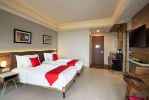 Postelja oz. postelje v sobi nastanitve Ramada by Wyndham Serpong