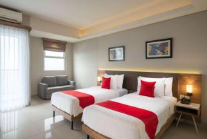 Postelja oz. postelje v sobi nastanitve Ramada by Wyndham Serpong