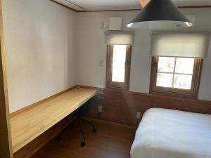 A private inn where you can relax in nature and enjoy with groups of up to 14 people客房内的一张或多张床位