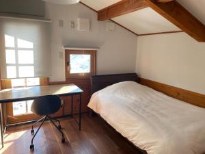 A private inn where you can relax in nature and enjoy with groups of up to 14 people客房内的一张或多张床位