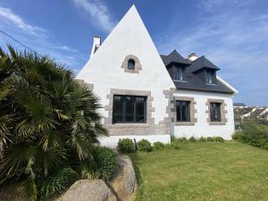 a white house with a black roof at Grande maison au centre de Perros-Guirec avec jardin, terrasse et WIFI - FR-1-368-460 in Perros-Guirec