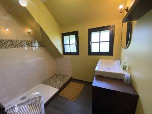 a bathroom with a sink and a bath tub at Grande maison au centre de Perros-Guirec avec jardin, terrasse et WIFI - FR-1-368-460 in Perros-Guirec +24 photos