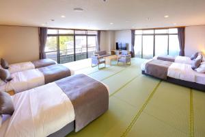 Ένα ή περισσότερα κρεβάτια σε δωμάτιο στο Ooedo Onsen Monogatari Premium Yamashitaya