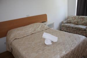 Postel nebo postele na pokoji v ubytování Coburg Motor Inn