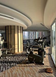 a gym with treadmills and exercise equipment in a building at Sky Residence in Ekkamai in Bangkok +17 photos