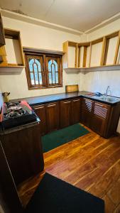 Kuchyň nebo kuchyňský kout v ubytování Nuwara Eliya Holiday Home