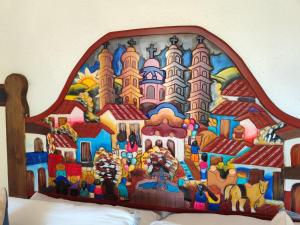 a painting of a disney castle on a headboard at Casa de las Conchas Cuernavaca in Cuernavaca