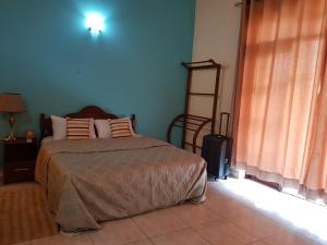 Ένα ή περισσότερα κρεβάτια σε δωμάτιο στο Homestay in Rajagiriya with Easy access to Colombo