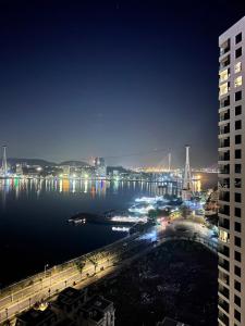 a view of a harbor at night with a city at An Bình homestay - Sapphire S2, Bến Đoan, Hạ Long, Quảng Ninh in Ha Long +2 photos