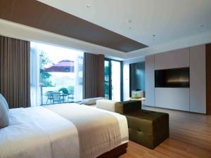 Katil atau katil-katil dalam bilik di Zhangjiajie Four Seasons Resort Riverside
