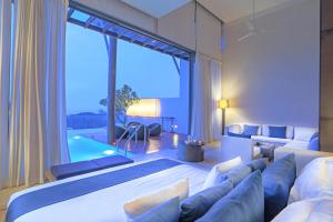 Postel nebo postele na pokoji v ubytování Veranda Pool Villas & Suite