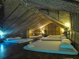 Voodi või voodid majutusasutuse Mansueto's Beach Resort toas