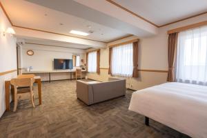 TV a/nebo společenská místnost v ubytování Toyoko Inn Daejeon Government Complex
