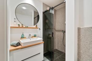 a bathroom with a sink and a shower at Apartmán Klement in Znojmo +35 photos