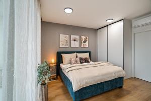 a bedroom with a large bed in a room at Apartmány Klement in Znojmo