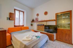 Μια τηλεόραση ή/και κέντρο ψυχαγωγίας στο Casa Gio - Happy Rentals