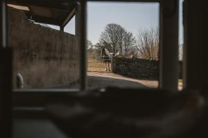 a view from a window of a field and a fence at Highside Farm in Bassenthwaite