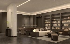 Atour Hotel Wuxi Baolong Plaza Changjiang Road في ووشي: غرفة معيشة مع أريكة وطاولة وكراسي