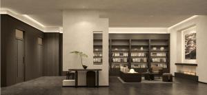 Atour Hotel Wuxi Baolong Plaza Changjiang Road في ووشي: ردهة بها أريكة وطاولة وكتب