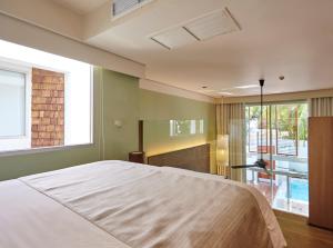 Postel nebo postele na pokoji v ubytování Veranda Pool Villas & Suite