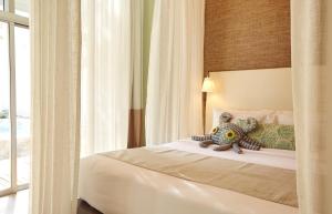 Postel nebo postele na pokoji v ubytování Veranda Pool Villas & Suite