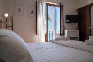 Postel nebo postele na pokoji v ubytování Casa Scala