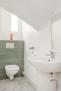 Kúpeľňa v ubytovaní Merveil - Family Suite - Marais - Martin V