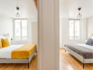 Posteľ alebo postele v izbe v ubytovaní Merveil - Family Suite - Marais - Martin V